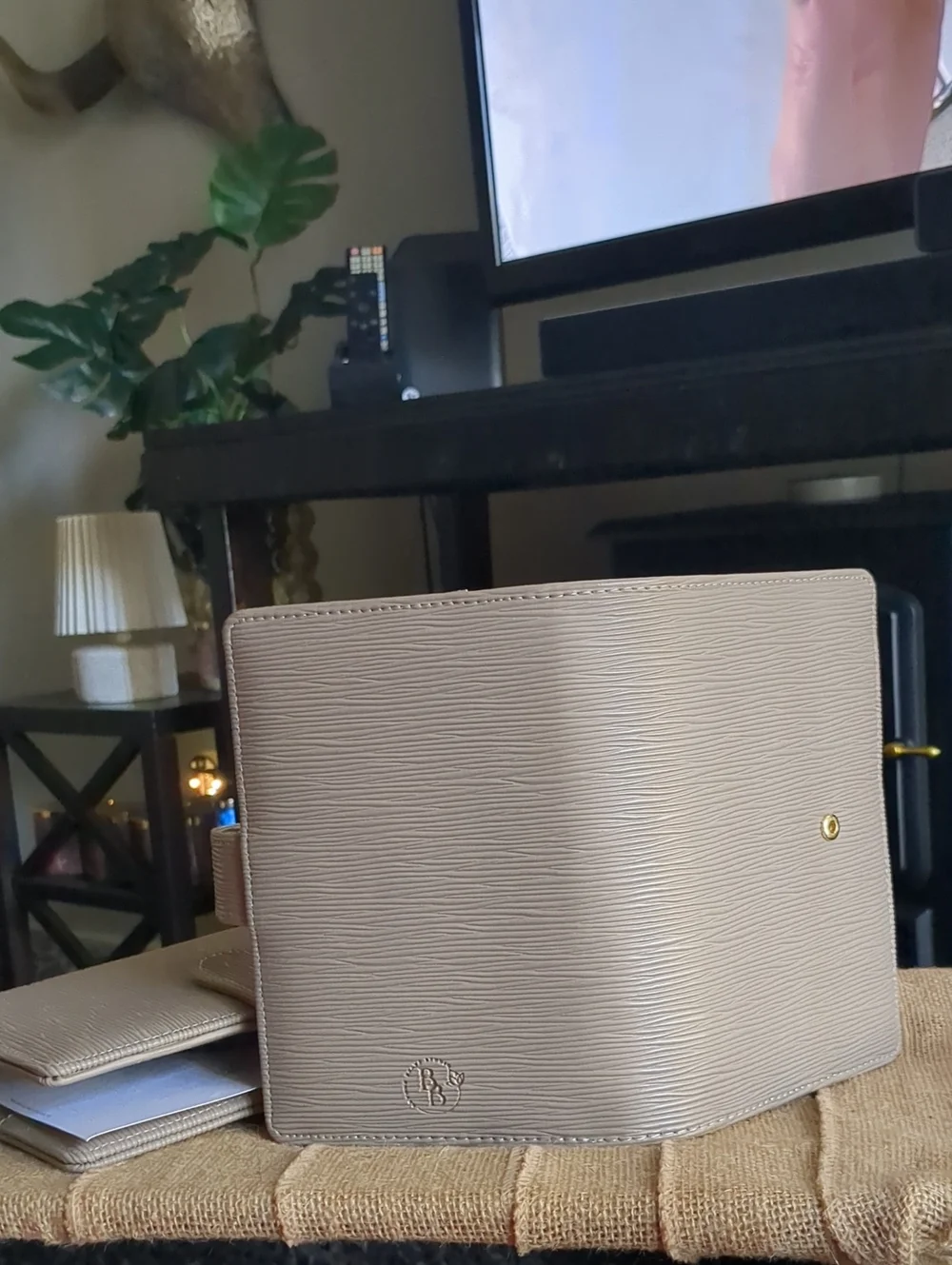 Taupe Textured Saffiano Binder With Gold Hardware.